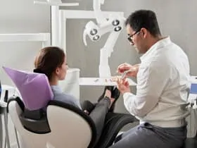 Photograph of patient and dentist discussing Cosmetic Dentistry, Hollywood, FL