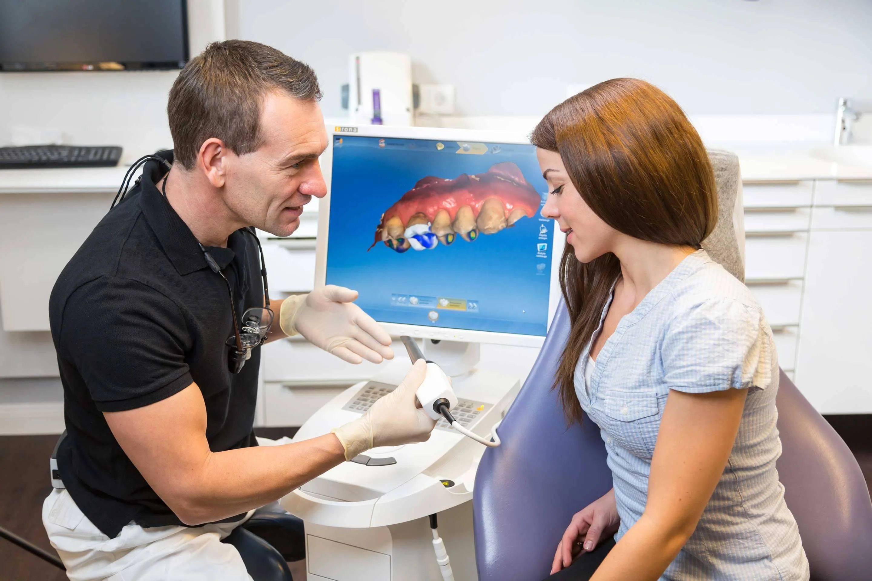 dentist showing patient cerec