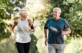 Senior couple jogging and smiling