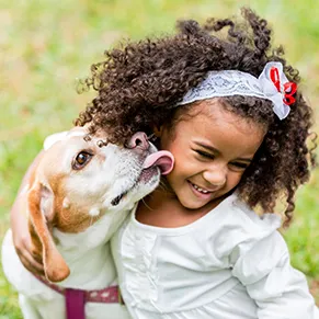 girl licked by a dog