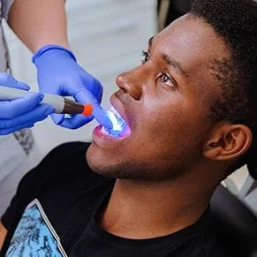 Dental patient receiving a dental inspection - Dentist San Diego