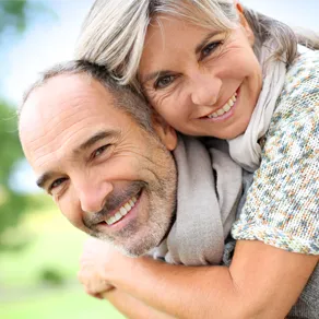 older couple outside hugging and smiling, sleep apnea airway management Houston, TX