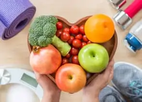 fruits and vegetables in heart-shaped bowl