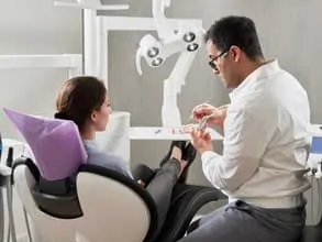 Photograph of dentist talking with patient, Holistic Dentistry, Honolulu, HI