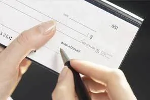 person writing a check