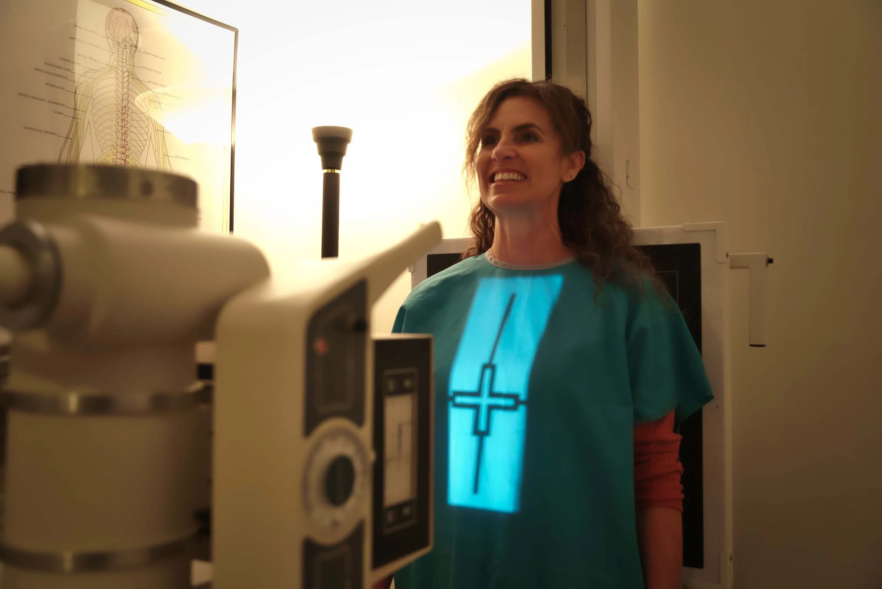 A woman smiling while being examined