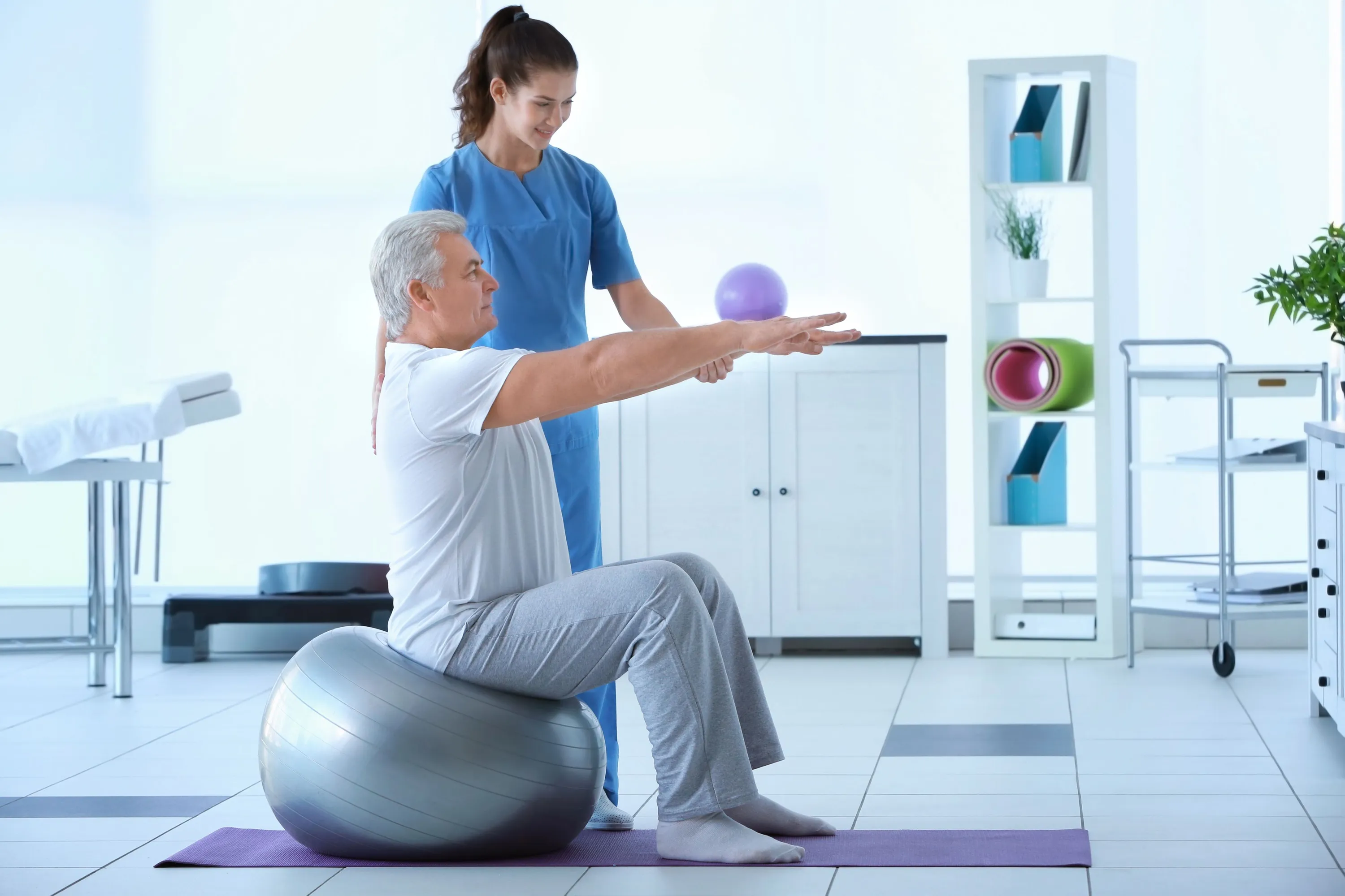 Physiotherapist working with patient in clinic