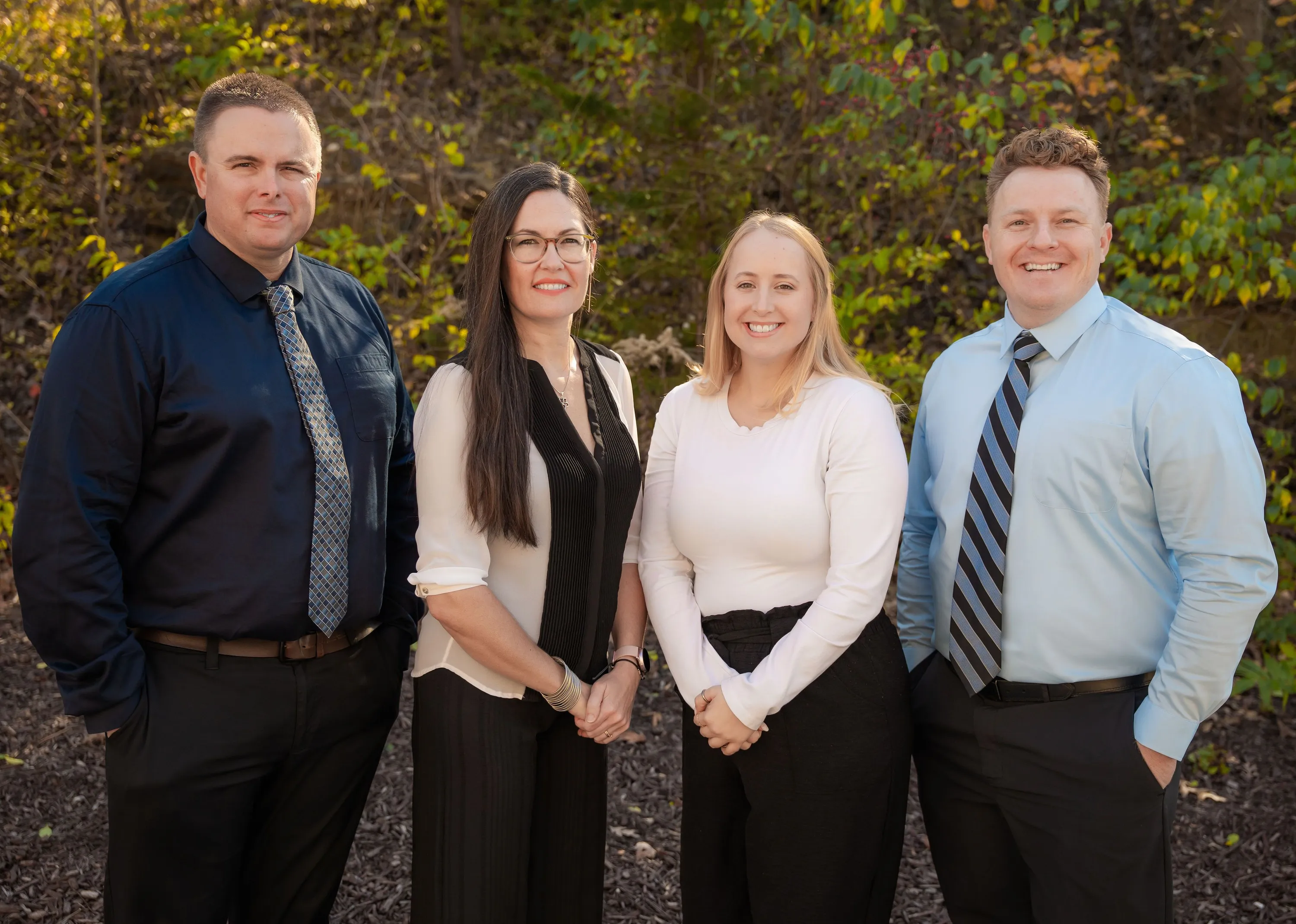 Doctors standing next to assistants