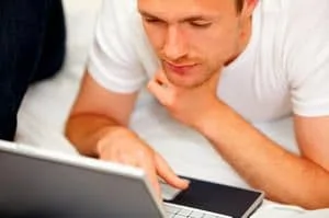 man looking at laptop