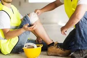 worker holding knee
