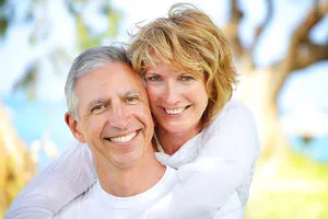 older couple with dental implants Manteca, CA