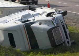 Semi truck rolled on the side of the road