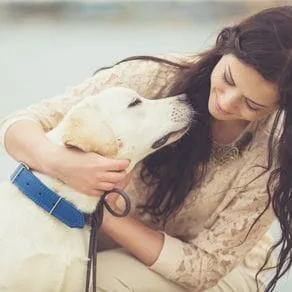 A woman petting her dog