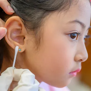 child cleaning ear