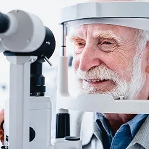 Older man having eyes scanned