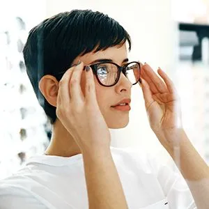 women trying on glasses