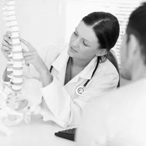 Doctor demonstrating on a spine