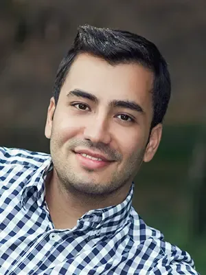 man in checkered shirt smiling, emergency dental care Colonial Heights, VA dentist