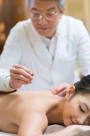 Acupuncture Treatment in Plantation: female patient experiencing body relief 