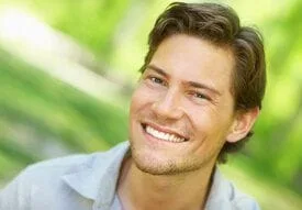 man smiling outdoors Issaquah, WA dental crowns