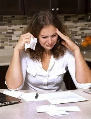 Woman stressed out over bills