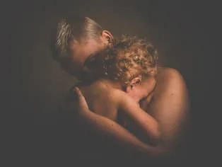 parent and child embracing