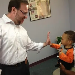 Doctor High-Fiving young patient