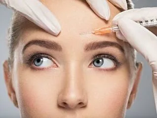 woman getting Botox injection treatment into forehead at dentist, Botox Santa Rosa Beach, FL