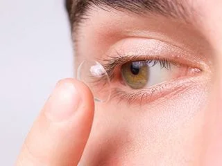 a person putting on contacts