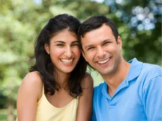 Smiling couple with our Dental Implants Rochester MI