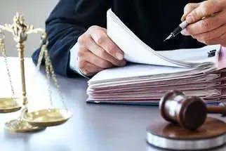 Attorney checking notes of a Roundup Case