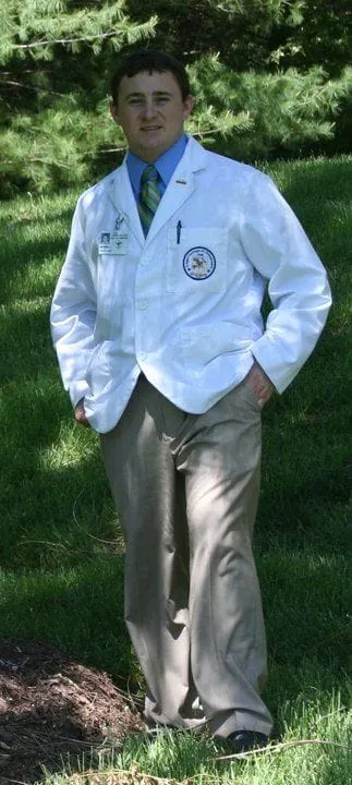 Picture of Dr. Patrick Healy in his clinic attire before graduating from Logan College of Chiropractic