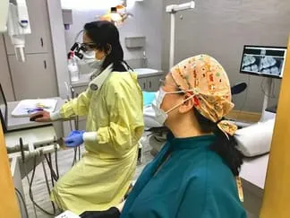 dentist and patient discussing dental implant restoration Millbrae, CA