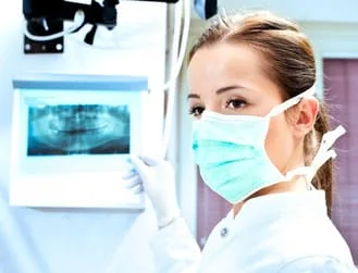 female dentist looking at dental x-ray, General Dentistry Mt Airy, NC