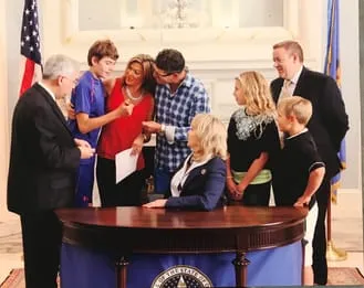 signing of Katie and Cayman's law 2015