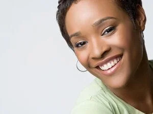 black woman smiling beautiful teeth dental implants Stafford, VA