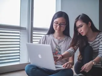 Female teens at computer