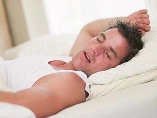man sleeping and snoring, sleep apnea treatment Beverly Hills, MI dentist