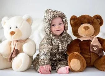 Baby with teddy bears