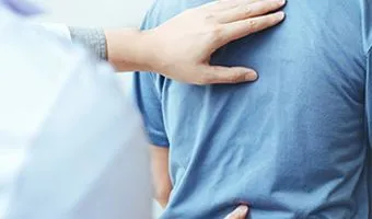 image of chiropractor adjusting a man's back