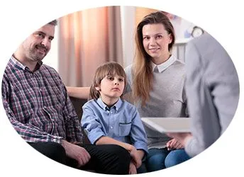 a mother, father, and son in a therapy session