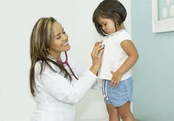 Dr. Castro examining young girl