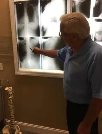 Dr. Simon looking at a patients xrays in Myrtle Beach