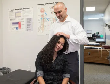 Man doing chiropractic adjustment to woman
