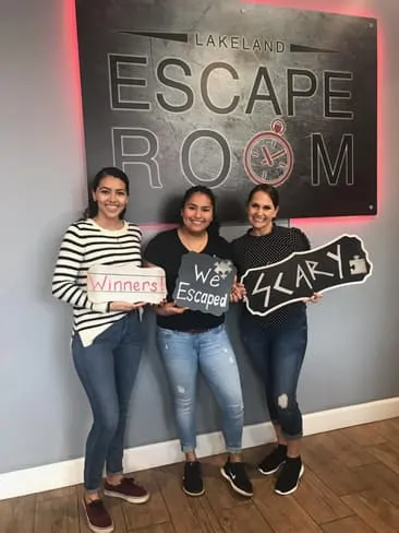 Gaby, Brisa and Dr. Bucci successfully escaped the "Insane Asylum" at the Lakeland Escape Room - 2018 Bucci Eye Care Christmas Party