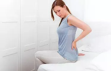 Woman suffering from back pain