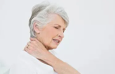 Woman suffering from neck pain