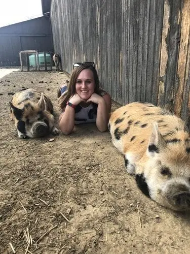 counselor with 2 pigs