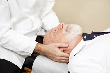 man having neck pain treatment