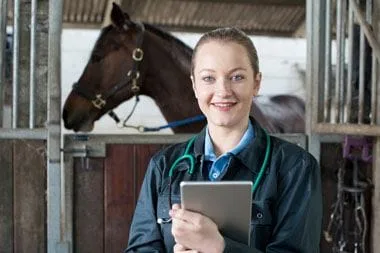 Doctor with horse in background